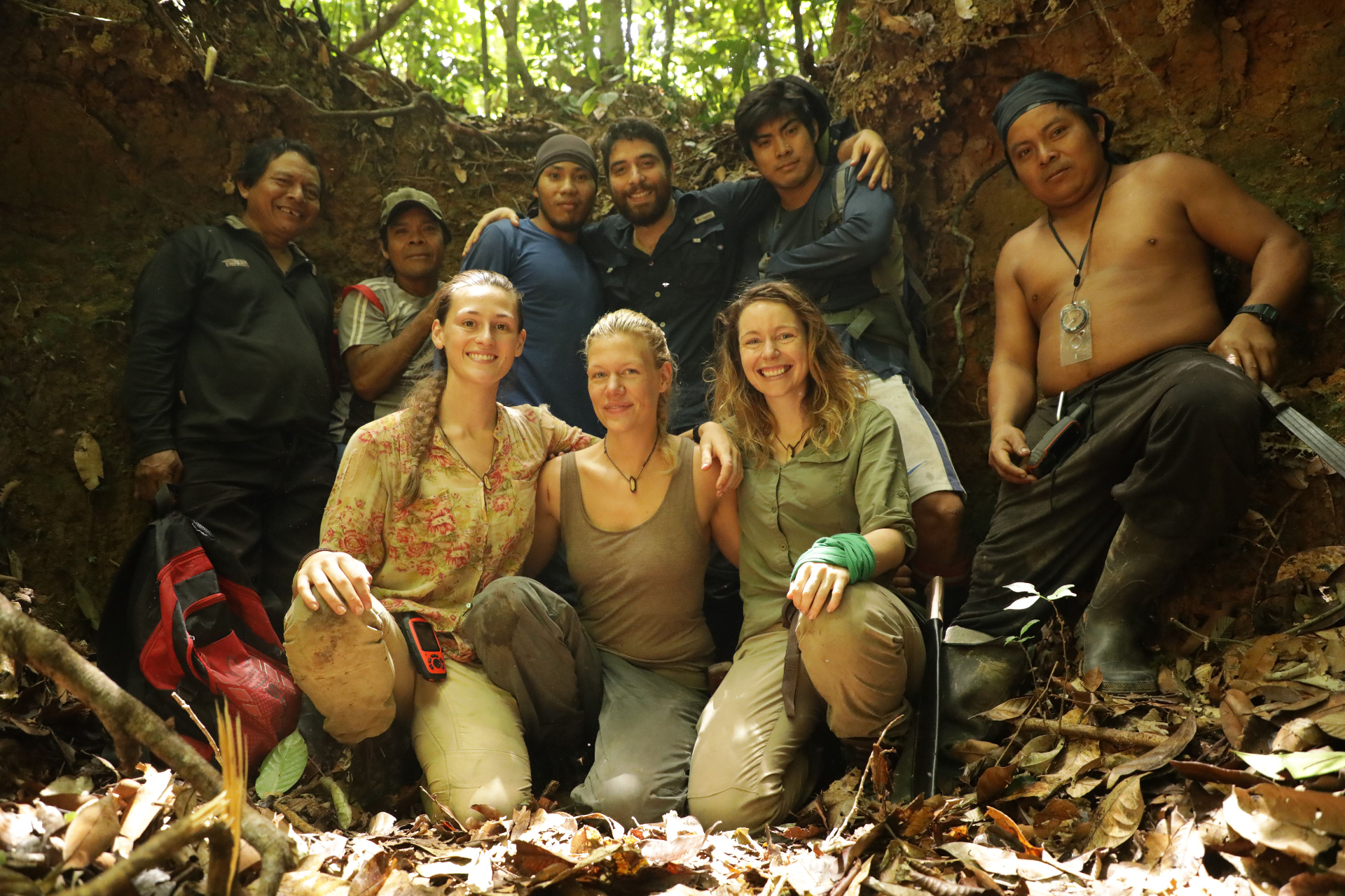 Laura with her expedition team in a rainforest dugout